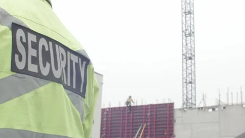Parking security watching over parking lot and construction site Stock Footage 237634114