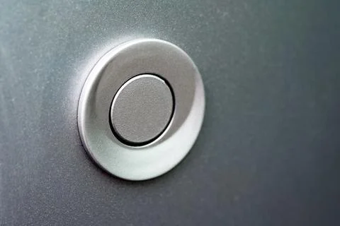 Parking sensor in gray close-up on the rear bumper of the car. Stock Photos