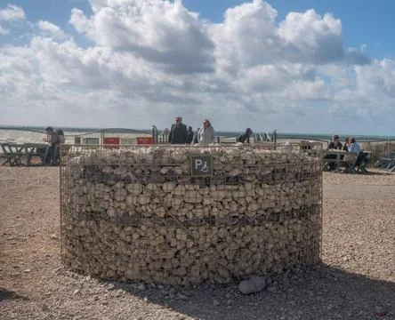 Parking space for disabled driver built from beach pebbles Basket holding ... Stock Photos