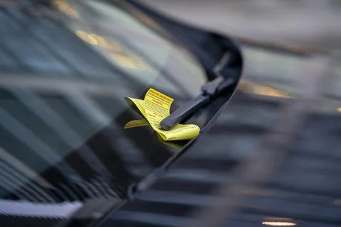 Parking Ticket Under Windshield Wiper on Car Close Up Urban Scene Fotos Stock
