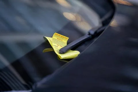 Parking Violation Ticket Under Windshield Wiper Close Up Detail Stock Photos