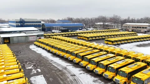Parking for yellow school buses. Winter time, snowfall. Stock Footage 326865417