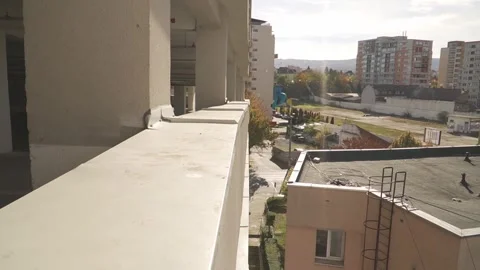 Parkour Athlete Performs a Precision Front Flip Roof Gap Jump Stock Footage 306839201