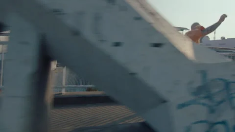 Parkour Athlete Running and Doing Side Flip on Urban Bridge Stock Footage 242099062