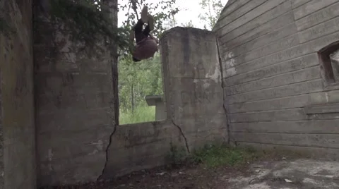 Parkour Flips Through Grunge Abandoned Building Ruins Stock Footage 52447779