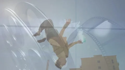 Parkour trainee pausing on roof, launching backflip, trailing teal smoke, Stock-Footage 333720323