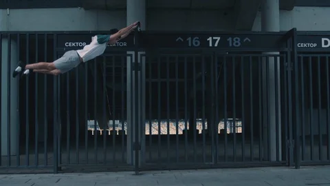 Parkourist does tricks in the city Stock Footage 117546693