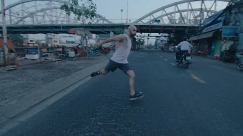 Parkourist Performing Backflip on the Road Stock Footage 242096554