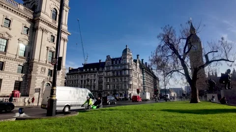 Parliament Square in Westminster features the Big Ben clock tower and Stock-Footage 328353295