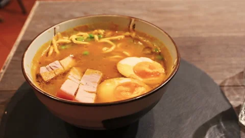Parma, Emilia-Romagna, Italy. Close-up on a bowl of ramen with an Italian Stock Footage 168256655