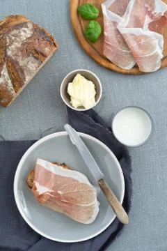 Parma ham on rustic bread Stock Photos