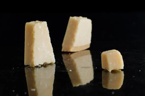 Parmesan arranged on marble table. Delicious dry uncooked ingredients for Stock Photos