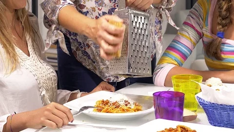 Parmesan cheese being grated on spaghetti closeup 4K slow motion Stock Footage 80508196