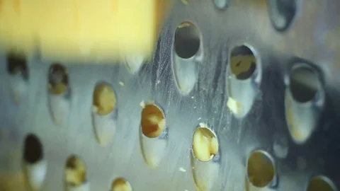 Parmesan cheese on chopping kitchen grater Stock-Footage 70577653