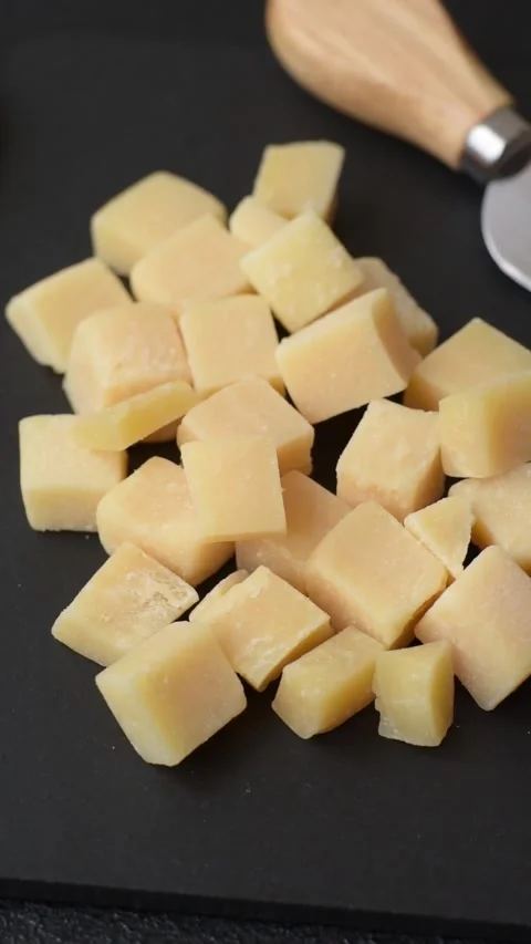 Parmesan cheese cubes for pasta, salads, and other Italian dishes. Parmesan chee Stock Footage 333465378