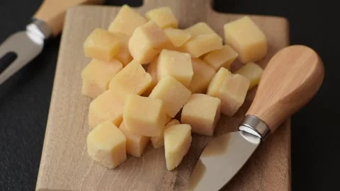 Parmesan cheese cubes for pasta, salads, and other Italian dishes. Parmesan chee Stock Footage 333465382