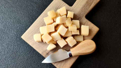 Parmesan cheese cubes for pasta, salads, and other Italian dishes. Parmesan chee Stock Footage 333465549