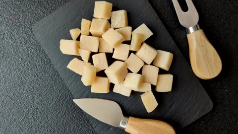 Parmesan cheese cubes for pasta, salads, and other Italian dishes. Parmesan chee Stock Footage 333465611