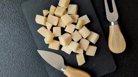Parmesan cheese cubes for pasta, salads, and other Italian dishes. Parmesan chee Stock Footage 333465612