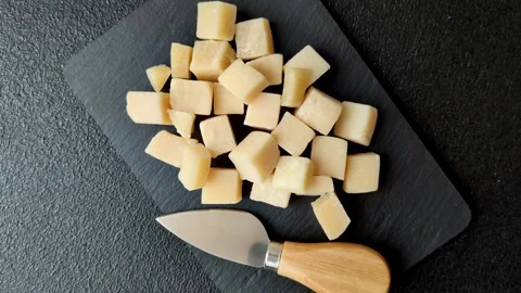 Parmesan cheese cubes for pasta, salads, and other Italian dishes. Parmesan chee Stock Footage 333465619