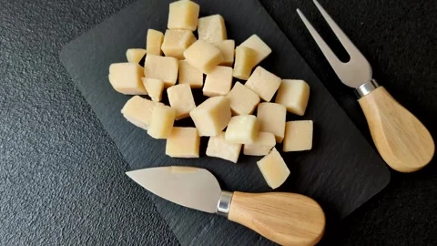 Parmesan cheese cubes for pasta, salads, and other Italian dishes. Parmesan chee Stock Footage 333465621