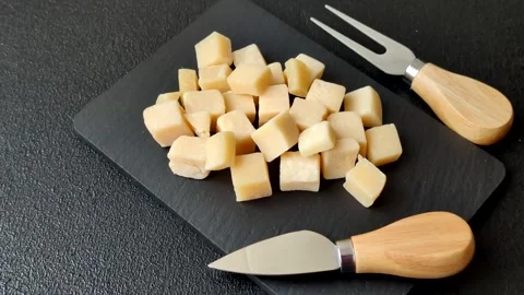 Parmesan cheese cubes for pasta, salads, and other Italian dishes. Parmesan chee Stock Footage 333465623