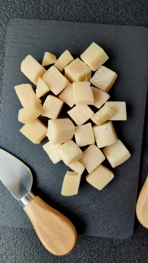 Parmesan cheese cubes for pasta, salads, and other Italian dishes. Parmesan chee Stock Footage 333465626