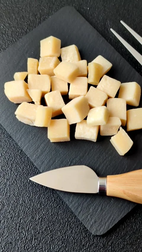 Parmesan cheese cubes for pasta, salads, and other Italian dishes. Parmesan chee Stock Footage 333465628