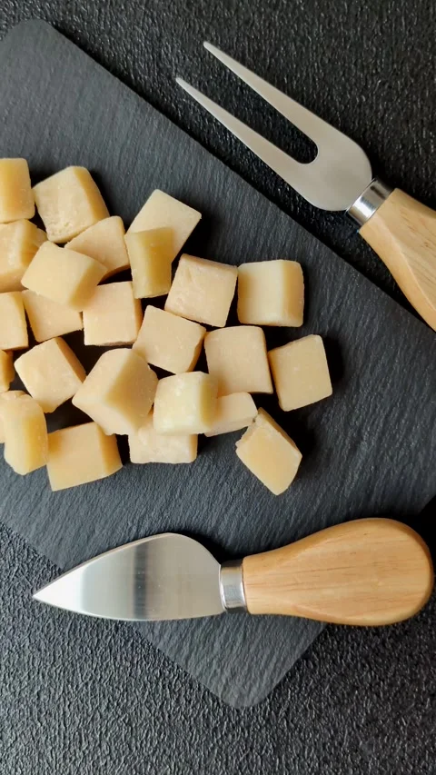 Parmesan cheese cubes for pasta, salads, and other Italian dishes. Parmesan chee Stock Footage 333465633