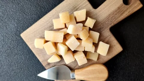 Parmesan cheese cubes for pasta, salads, and other Italian dishes. Parmesan chee Stock Footage 333465635