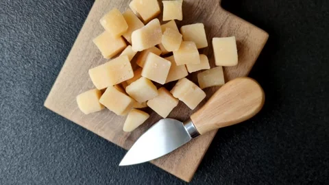 Parmesan cheese cubes for pasta, salads, and other Italian dishes. Parmesan chee Stock Footage 333465643