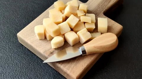 Parmesan cheese cubes for pasta, salads, and other Italian dishes. Parmesan chee Stock Footage 333465648