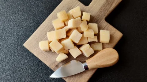 Parmesan cheese cubes for pasta, salads, and other Italian dishes. Parmesan chee Stock Footage 333465650