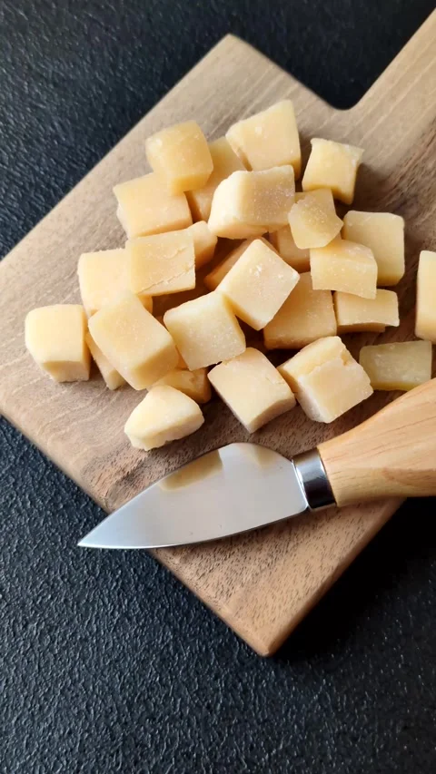 Parmesan cheese cubes for pasta, salads, and other Italian dishes. Parmesan chee Stock Footage 333465652