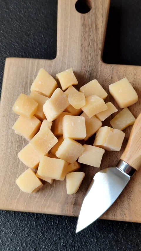 Parmesan cheese cubes for pasta, salads, and other Italian dishes. Parmesan chee Stock Footage 333465659