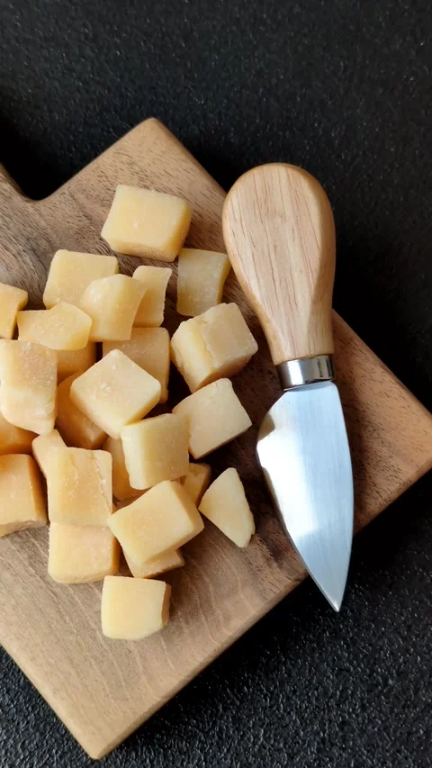 Parmesan cheese cubes for pasta, salads, and other Italian dishes. Parmesan chee Stock Footage 333465664