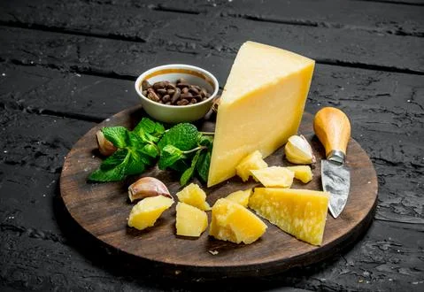 Parmesan cheese with garlic, pine nuts and mint leaves. Stock Photos