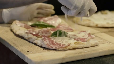 Parmesan cheese on pizza Stock Footage 86170132