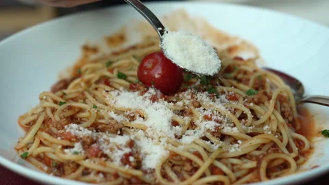 Parmesan Cheese Sprinkled Over Spaghetti Bolognese Stock Footage 344824214