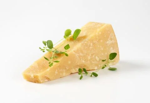 Parmesan cheese wedge Stock Photos