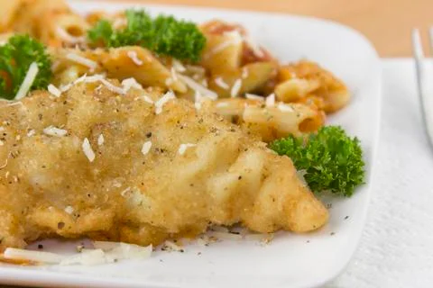 Parmesan crusted fish closeup Stock Photos