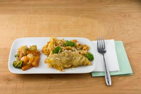Parmesan crusted fish dinner Stock Photos