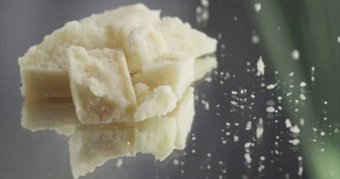 Parmesan falls on a mound of parmesan Stock Footage 197865749