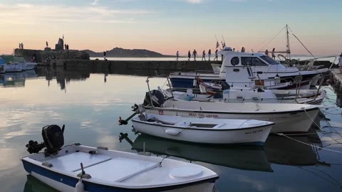 Paros Island,Circular pan left around small harbor with small boats side by Stock Footage 331122906