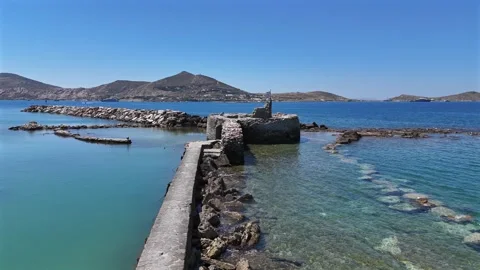 Paros,Aerial view forward towards ancient ruins of Venetian castle's tower and Vídeo Stock 331069048