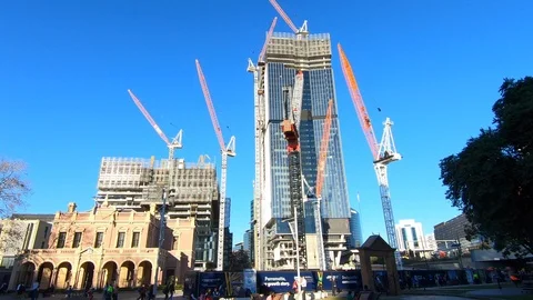 Parramatta Square under construction showing cranes and one building Video stock 113454189