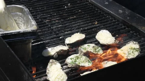 Parsley added to grilled shellfish Stock Footage 157338090