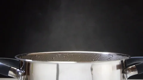 Parsley is put in soup. The cook is preparing soup. The pan is on the stove Stock-Footage 89840583