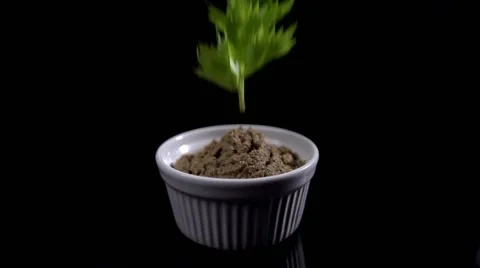 Parsley sprig is falling on a pate 库存影片 64544342