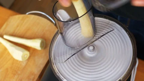 Parsnip being sliced in a food processor Video stock 72467801